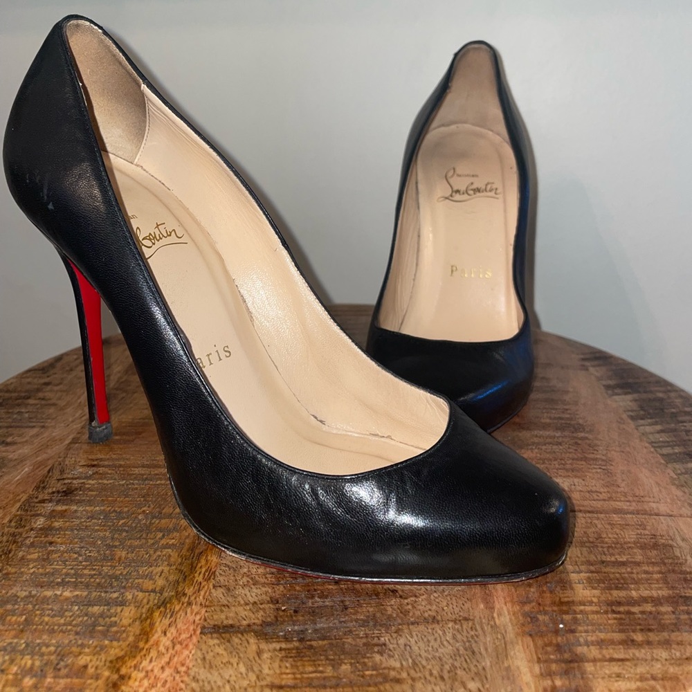 I am re-polishing a pair of Christian Louboutin black leather heels!